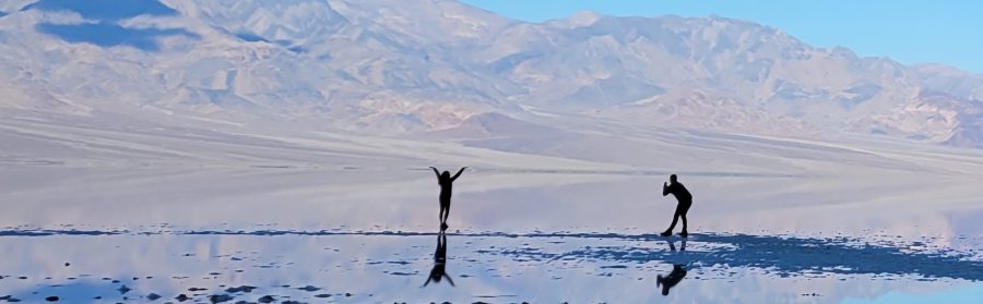 Two stupid people ruining bad water basin by walking in it, permanently damaging it.